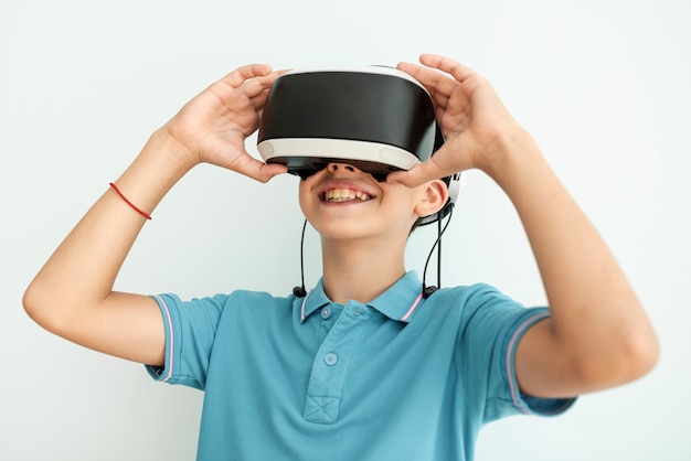 Front view happy child with vr glasses 
