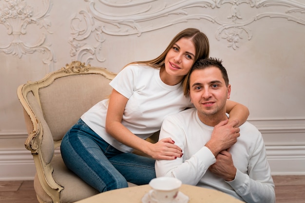 Front view of happy couple posing embraced