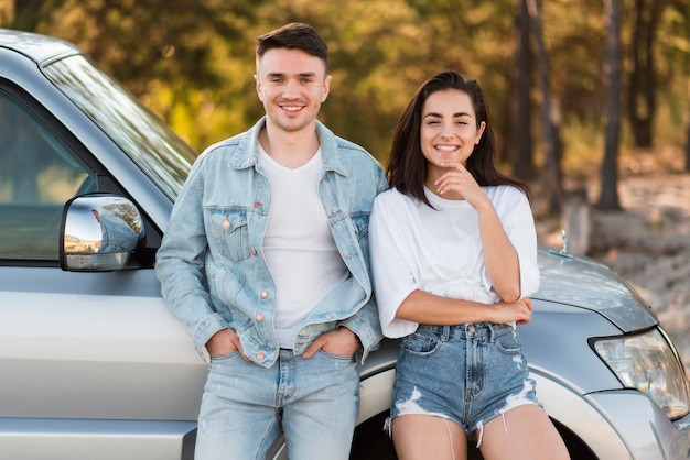 Free photo front view happy couple posing together