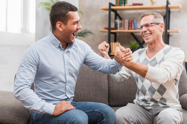 Free photo front view of happy father and son