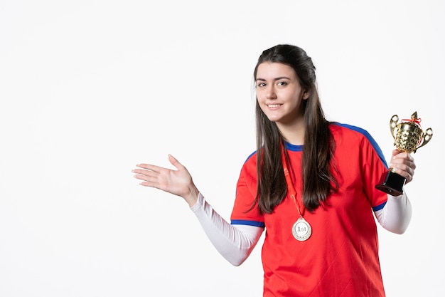 Front view happy female player with cup