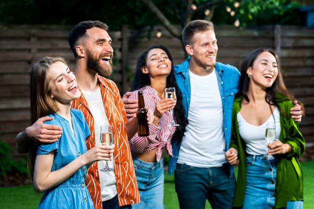 Front view happy friends together with drinks