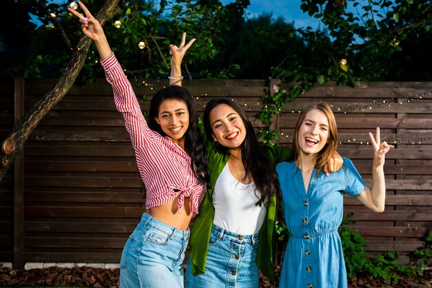 Front view happy girls together outdoors