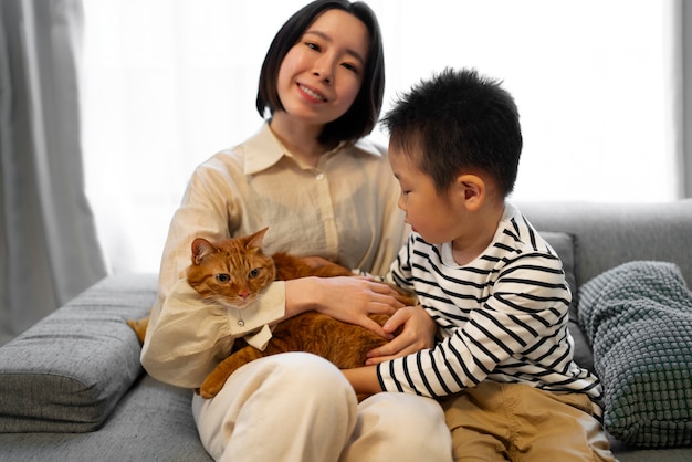 Front view happy japanese family with cat