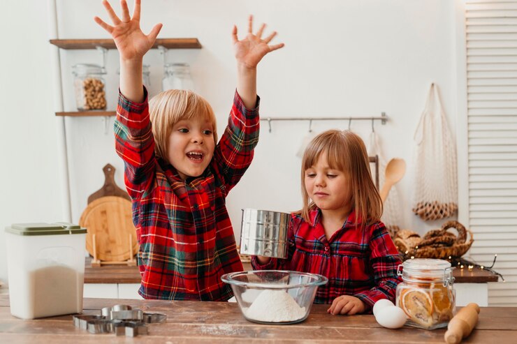 Free Photo front view happy kids cooking