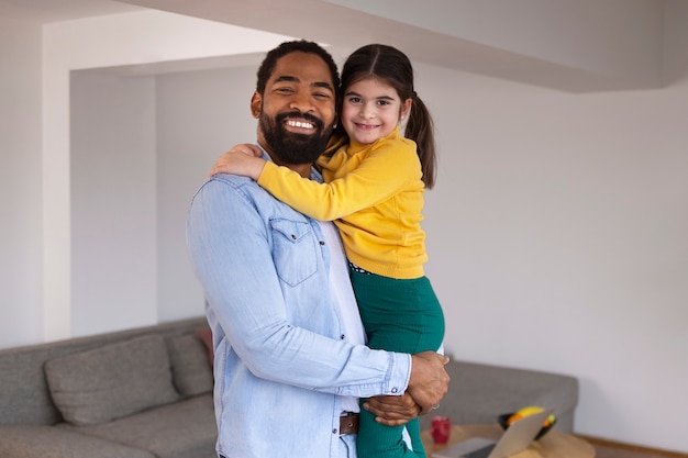front view happy parent with kid at home