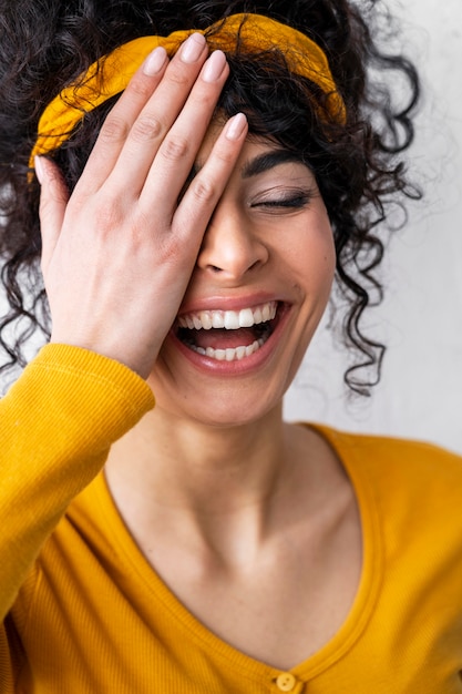 Front view of happy woman laughing