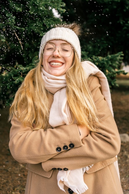 Free photo front view of happy woman at the park in winter