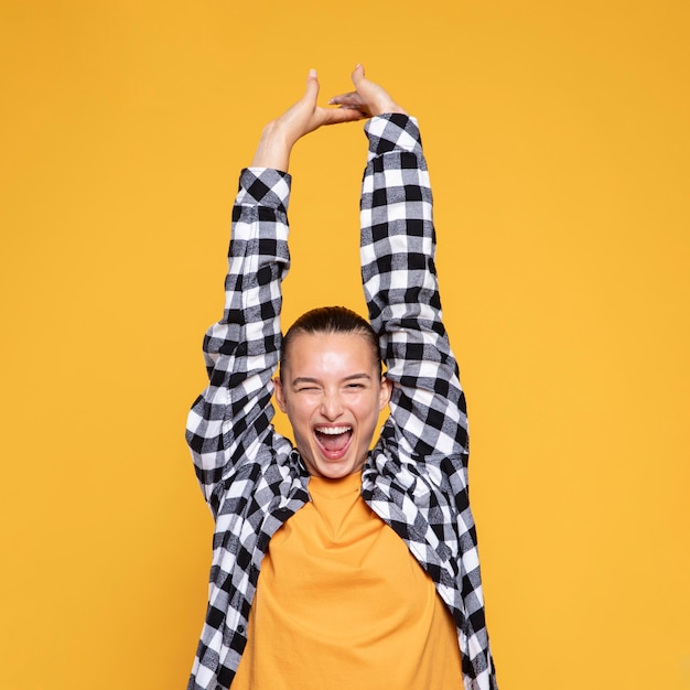 Free photo front view of happy woman with checkered shirt