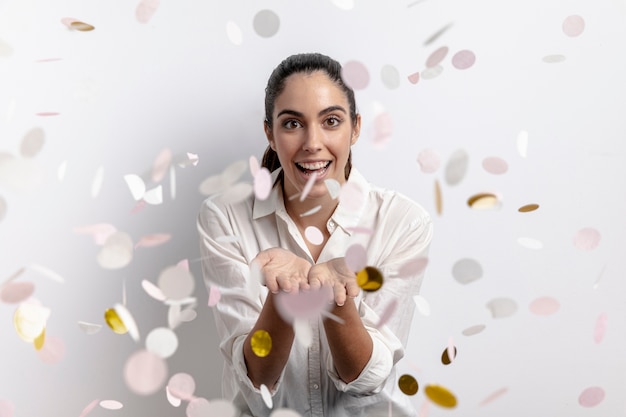 Front view of happy woman with confetti