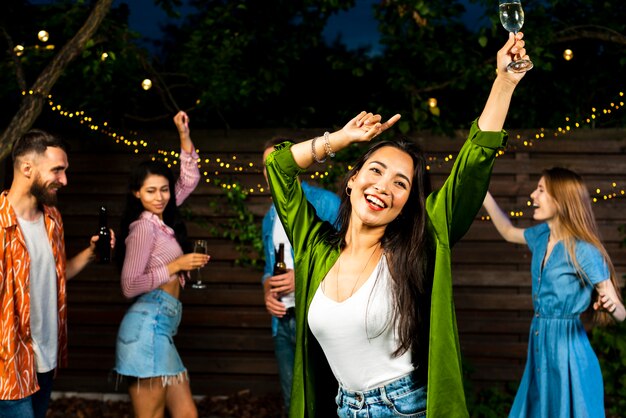 Front view happy young girl dancing