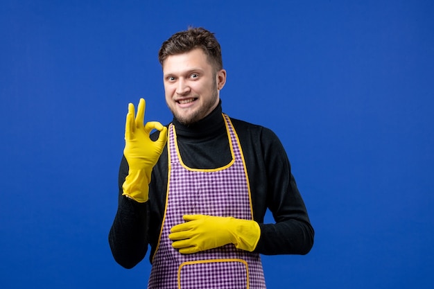 Front view happy young male making okey sign 