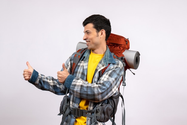 Free photo front view of happy young man with backpack giving thumbs up