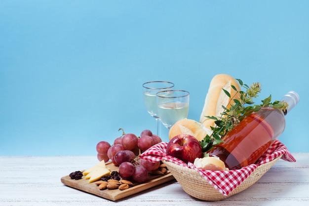 Front view healthy picnic goodies with blue background