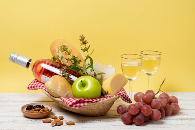 Front view healthy picnic goodies on wooden table