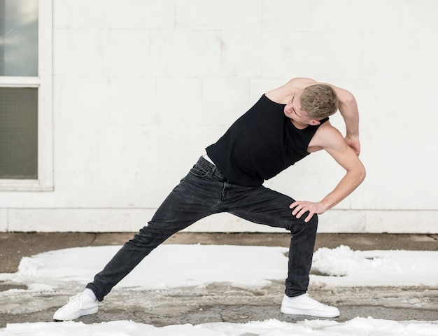 Front view of hip hop dance pose by man