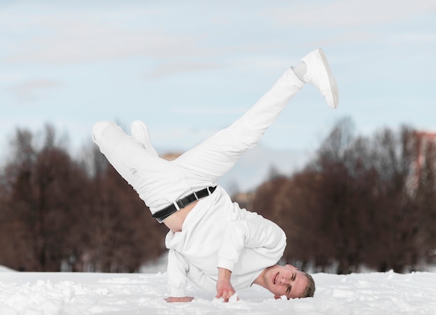 Front view of hip hop dancer posing outside