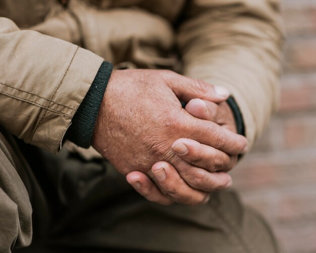 Front view of homeless man hands