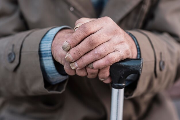 front view of homeless man with cane