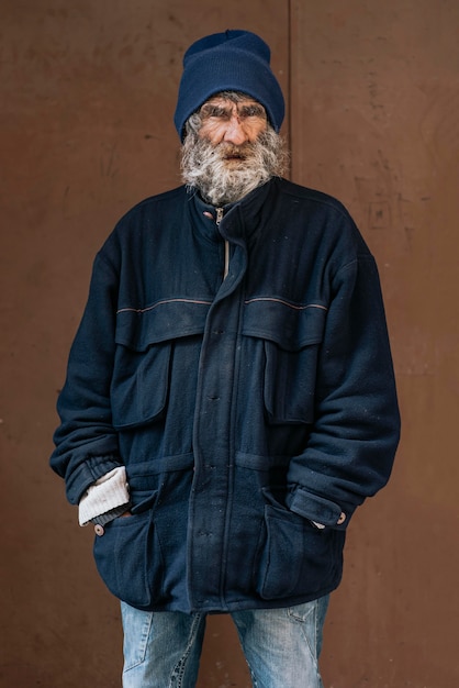 Front view of homeless man with warm jacket