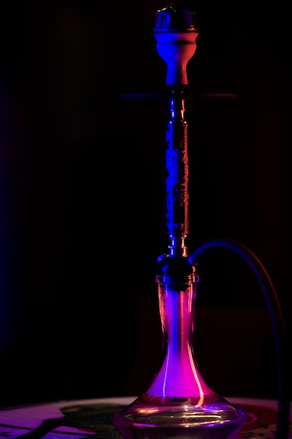 Front view hookah in a bar with fog around