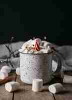 Free photo front view hot chocolate in mug with marshmallows