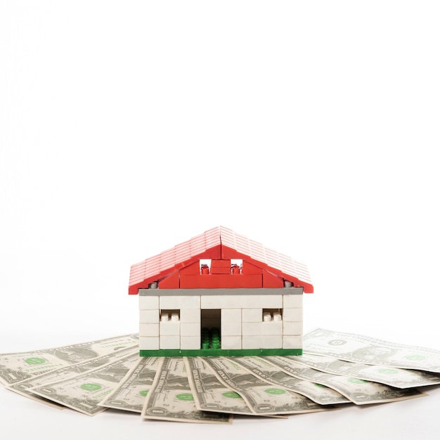 Free photo front view house with money bank-notes