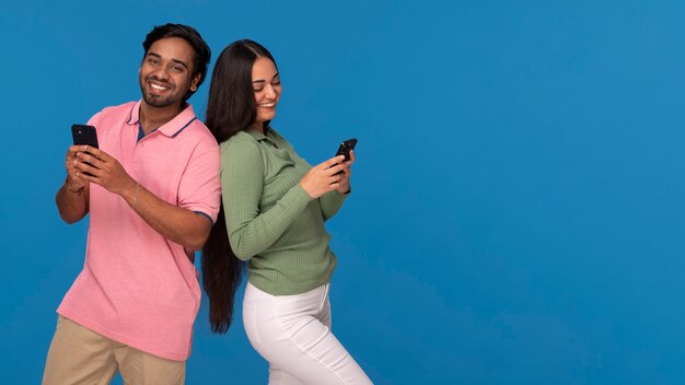 Front view indian friends posing in studio