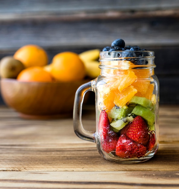 Front view jar filled with exotic fruit