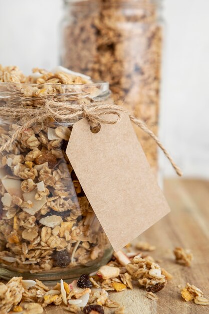 Front view of jars with breakfast cereals and tag