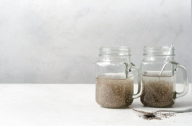 Front view jars with seeds and copy space