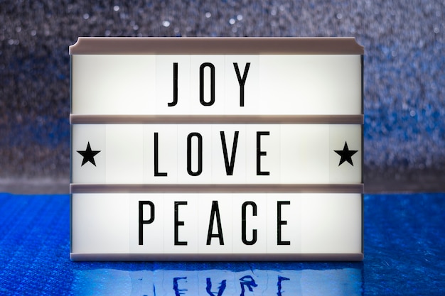 Front view joy love peace lettering