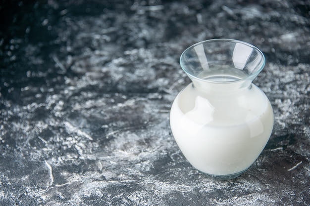 Free photo front view jug with milk on the light gray background dough egg meal cake pie color