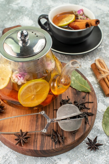 Front view kettle with tea lemon tea on white background flavor color morning breakfast food fruit ceremony flower