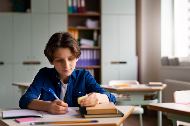 front view kid cheating at school