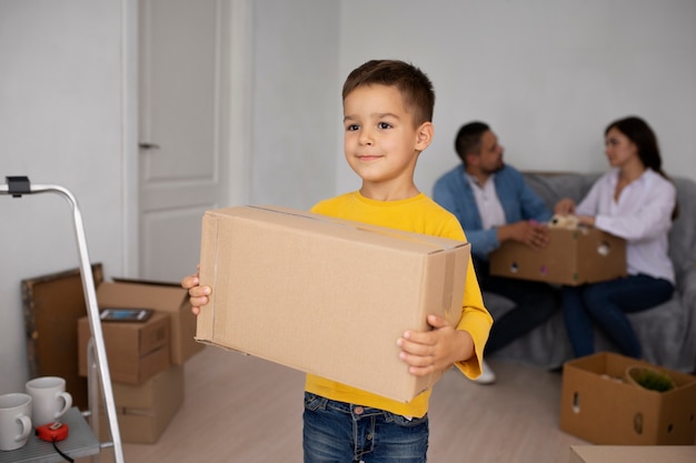 Front view kid holding box