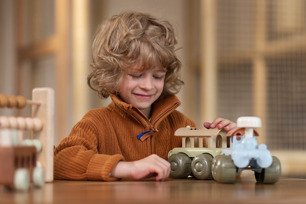 Front view kid playing with ecological toys