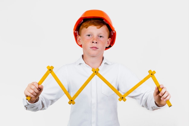 Free photo front view kid posing as construction worker