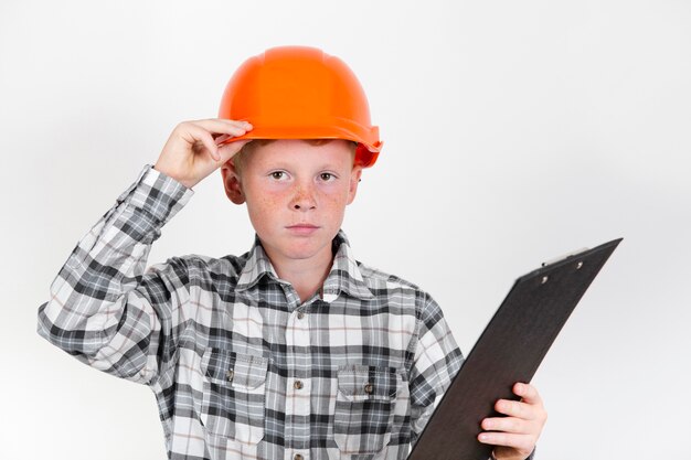 Free photo front view kid posing as construction worker