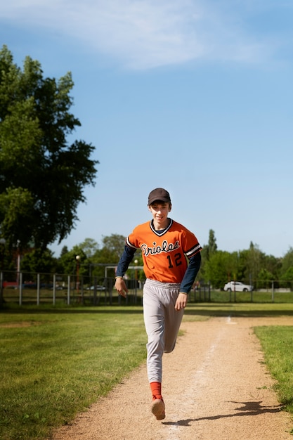 Front view kid running on field