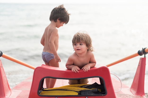 Front view of kids on paddle board