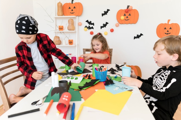 Free photo front view of kids with halloween conceptt