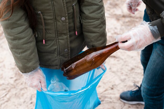 Front view of kids with plastic bag