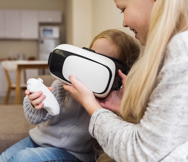 Free photo front view of kids with vr glasses