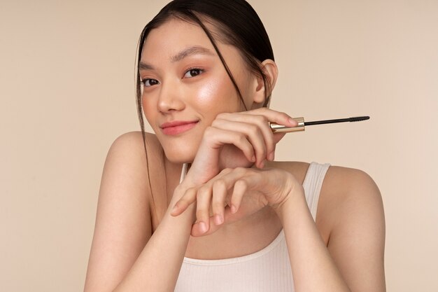 Front view korean woman posing with mascara