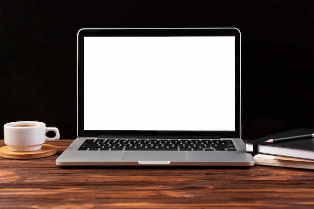 Front view of laptop on wooden table