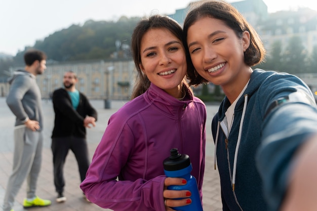 Front view latin people training outdoors