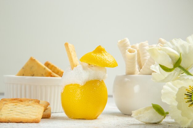 Front view lemon cocktail with crackers on white table citrus cocktail juice