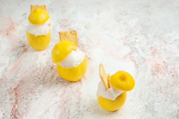 Front view lemon cocktails with ice on white table citrus juice cocktail fruit