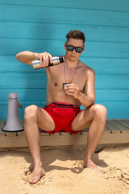 Free photo front view lifeguard pouring drink